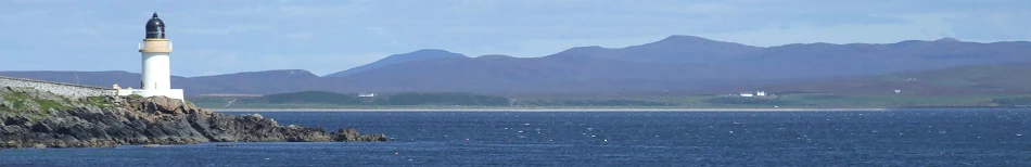 Panorama of Port Charlotte lighthouse on Loch Indaal, with the hills of Islay beyond
